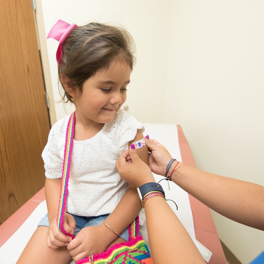 A girl receives a vaccine. Image by CDC on Pexels.com